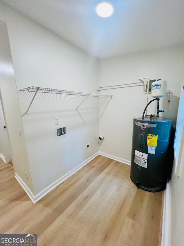 2502 Barge Rd SW, Atlanta, GA 30331 - washroom with washer hookup, laundry area, electric dryer hookup, light wood-style floors, and electric water heater