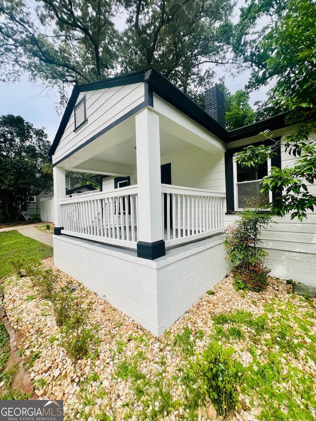 2502 Barge Rd SW, Atlanta, GA 30331 - view of property exterior with a chimney and a porch