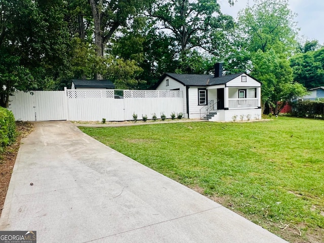 2502 Barge Rd SW, Atlanta, GA 30331 - single story home with covered porch, fence, driveway, and a gate