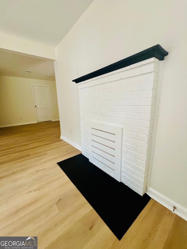 2502 Barge Rd SW, Atlanta, GA 30331 - interior details featuring baseboards, a fireplace, and wood finished floors
