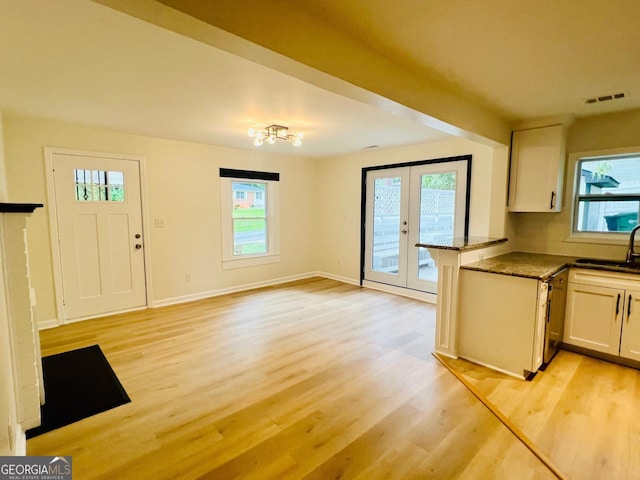 2502 Barge Rd SW, Atlanta, GA 30331 - kitchen featuring french doors, light wood-style flooring, visible vents, and a healthy amount of sunlight