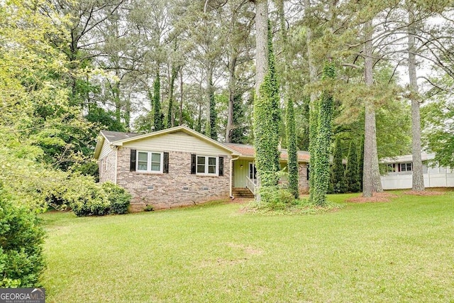 2621 Manor Pl, Ellenwood, GA 30294 - single story home featuring brick siding, fence, and a front yard