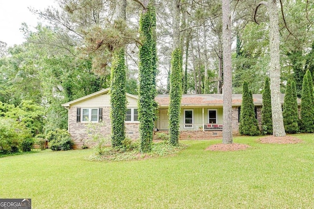 2621 Manor Pl, Ellenwood, GA 30294 - ranch-style home featuring covered porch and a front lawn