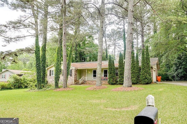 2621 Manor Pl, Ellenwood, GA 30294 - ranch-style home with a front lawn and covered porch