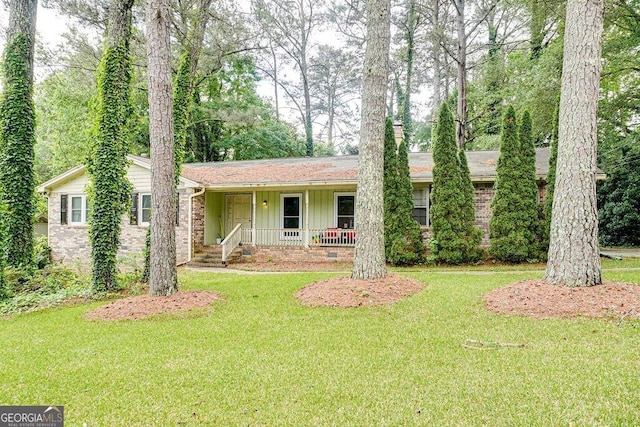 2621 Manor Pl, Ellenwood, GA 30294 - ranch-style house featuring covered porch, board and batten siding, brick siding, and a front yard