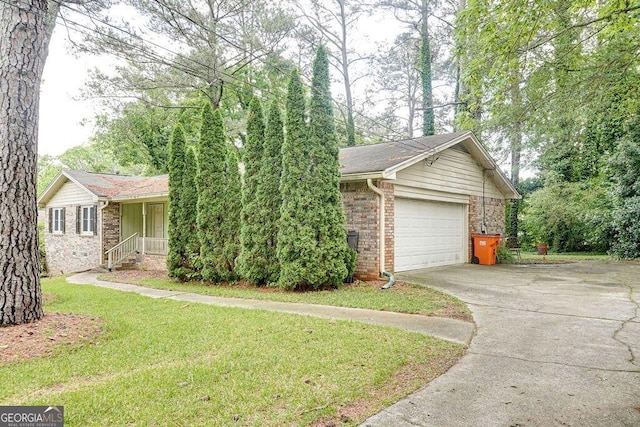 2621 Manor Pl, Ellenwood, GA 30294 - view of front of house featuring brick siding, a front yard, and concrete driveway