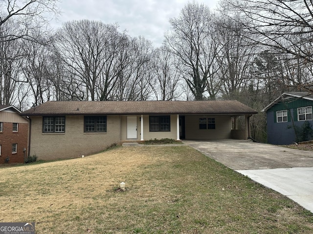 ranch-style house featuring brick siding, driveway, a carport, and a front lawn