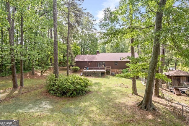 view of yard featuring a wooden deck