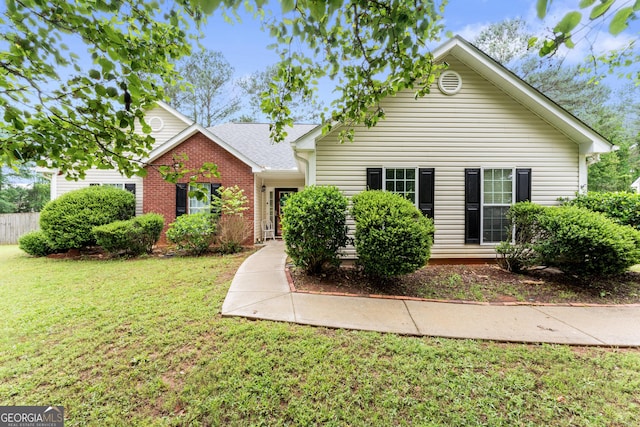 308 Dylan Way, Mcdonough, GA 30252 - view of front of home featuring a front yard and brick siding