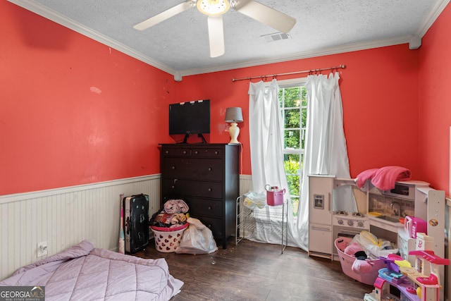 308 Dylan Way, Mcdonough, GA 30252 - bedroom with wainscoting, wood finished floors, a textured ceiling, ornamental molding, and a ceiling fan