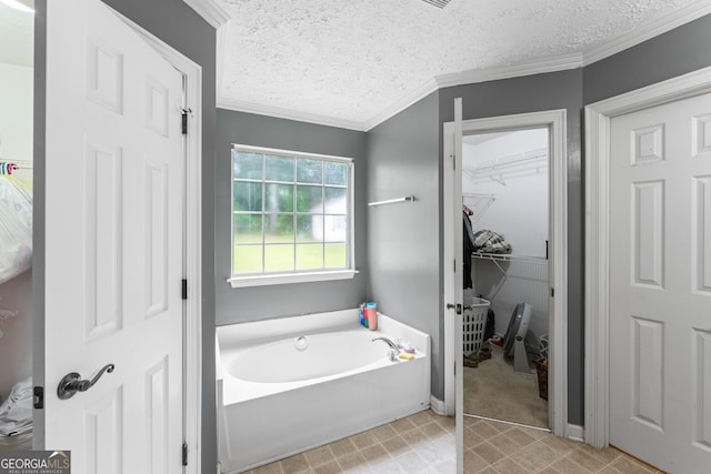 308 Dylan Way, Mcdonough, GA 30252 - full bathroom featuring a garden tub, a textured ceiling, crown molding, and a walk in closet