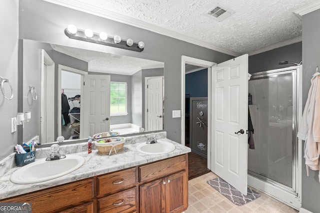 308 Dylan Way, Mcdonough, GA 30252 - bathroom featuring a stall shower, double vanity, crown molding, a spacious closet, and a textured ceiling