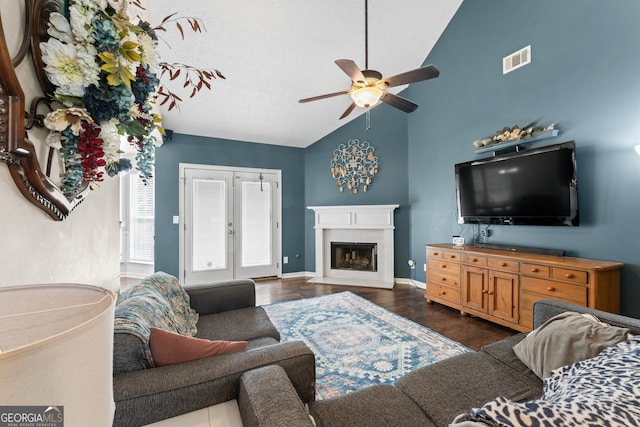 308 Dylan Way, Mcdonough, GA 30252 - living area featuring ceiling fan, wood finished floors, a fireplace, high vaulted ceiling, and baseboards