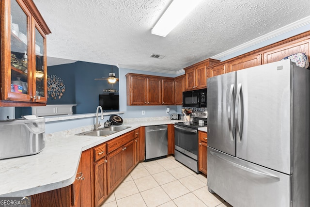 308 Dylan Way, Mcdonough, GA 30252 - kitchen featuring appliances with stainless steel finishes, a sink, light countertops, light tile patterned flooring, and glass insert cabinets