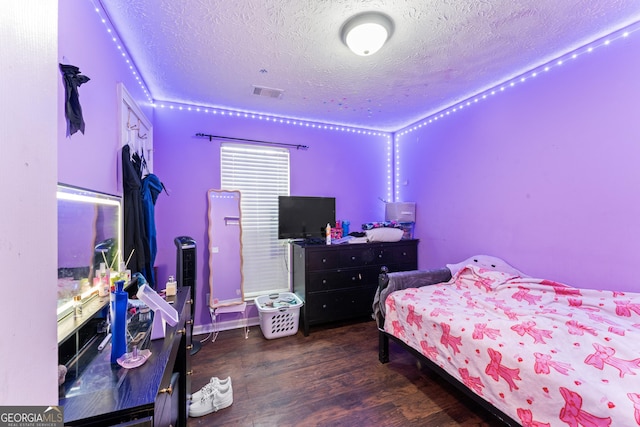 308 Dylan Way, Mcdonough, GA 30252 - bedroom with a textured ceiling and wood finished floors