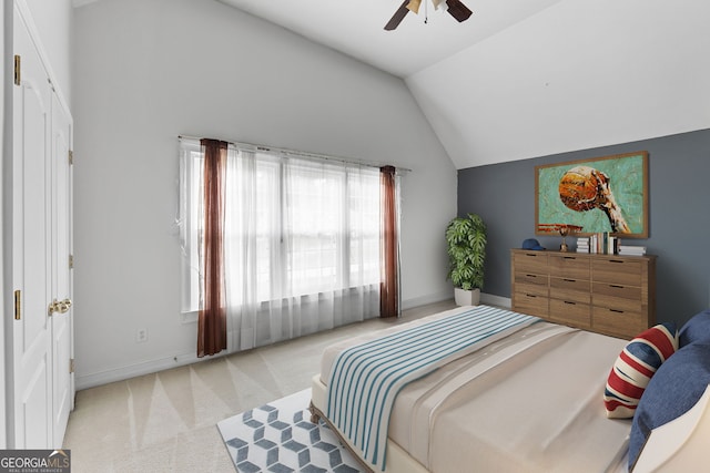 bedroom featuring baseboards, a ceiling fan, vaulted ceiling, and light colored carpet