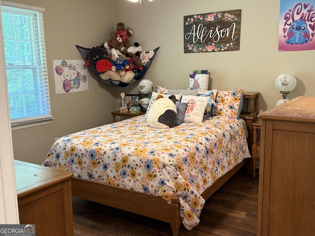 bedroom featuring wood finished floors