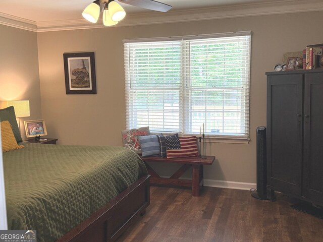 bedroom featuring crown molding, baseboards, and dark wood-type flooring