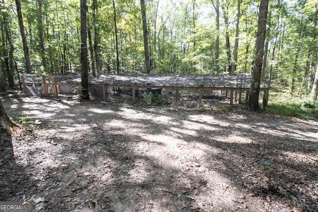 exterior space with a forest view