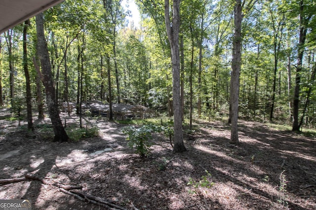 view of landscape featuring a wooded view