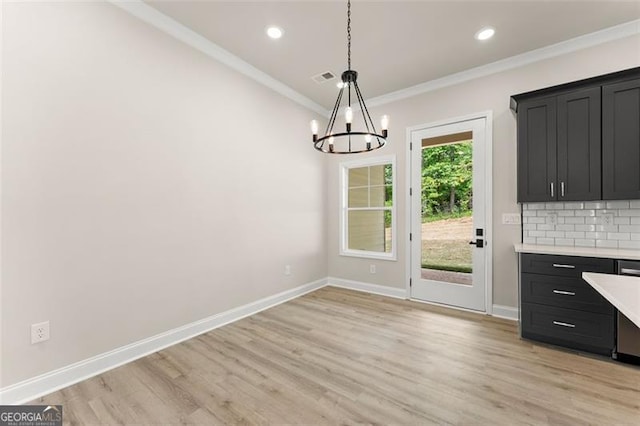 346 Chandler Ct, Alto, GA 30510 - unfurnished dining area featuring baseboards, light wood finished floors, crown molding, and a notable chandelier