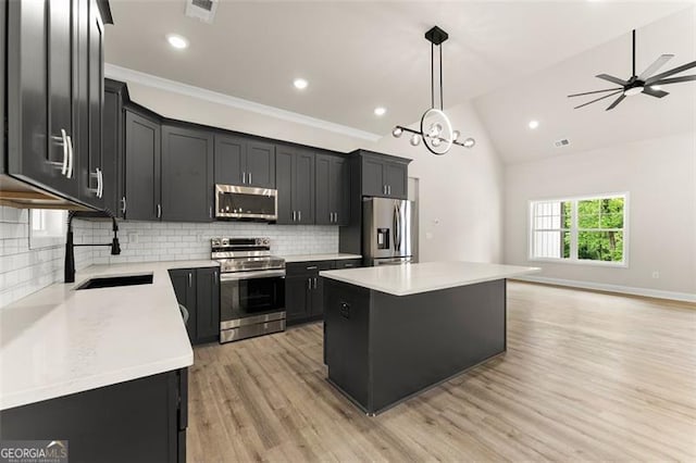 346 Chandler Ct, Alto, GA 30510 - kitchen featuring dark cabinetry, appliances with stainless steel finishes, a sink, and light wood-type flooring