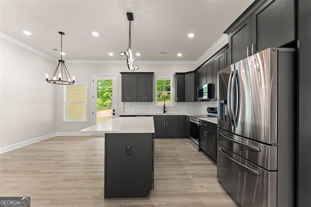 346 Chandler Ct, Alto, GA 30510 - kitchen with ornamental molding, a kitchen island, light countertops, tasteful backsplash, and stainless steel appliances