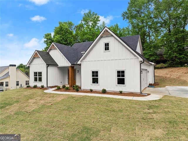 346 Chandler Ct, Alto, GA 30510 - modern farmhouse style home with board and batten siding, driveway, a front lawn, an attached garage, and a shingled roof
