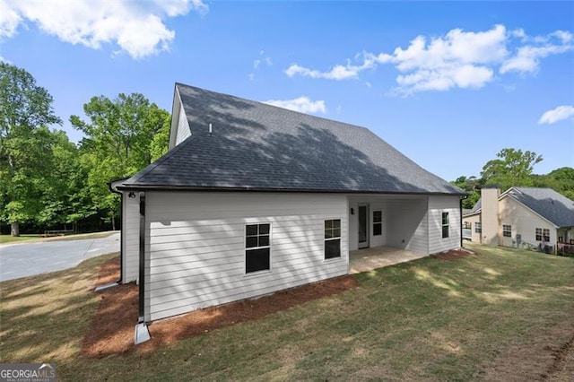 346 Chandler Ct, Alto, GA 30510 - rear view of house with a lawn, a patio, and a shingled roof