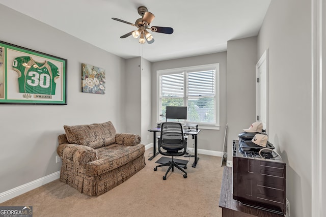 office featuring carpet floors, ceiling fan, and baseboards