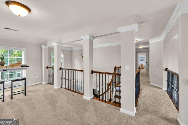 1584 Heartland Path, Hoschton, GA 30548 - corridor with carpet floors, an upstairs landing, decorative columns, and ornamental molding