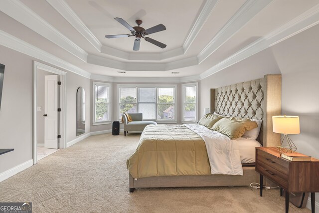 1584 Heartland Path, Hoschton, GA 30548 - carpeted bedroom with a tray ceiling, crown molding, and a ceiling fan