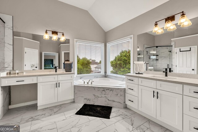 bathroom with a marble finish shower, marble finish flooring, a chandelier, two vanities, and lofted ceiling