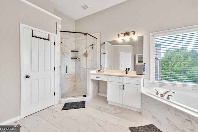 bathroom featuring plenty of natural light, a marble finish shower, a bath, and marble finish floors