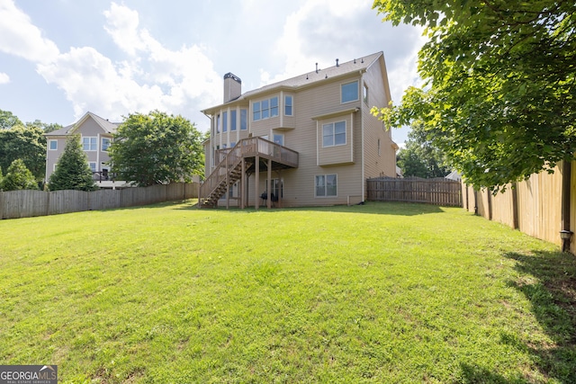 back of property featuring stairs, a chimney, and a wooden deck