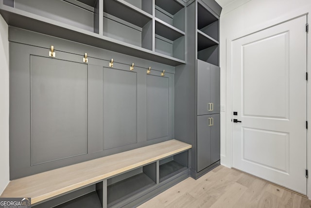 mudroom with light wood-style floors
