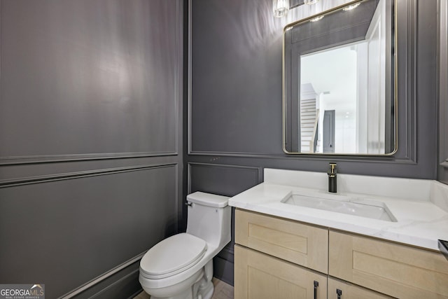 bathroom with vanity and toilet
