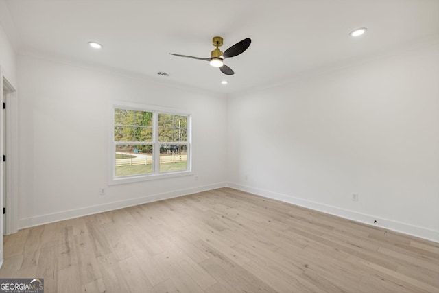 empty room featuring ceiling fan, light wood-style floors, recessed lighting, baseboards, and visible vents