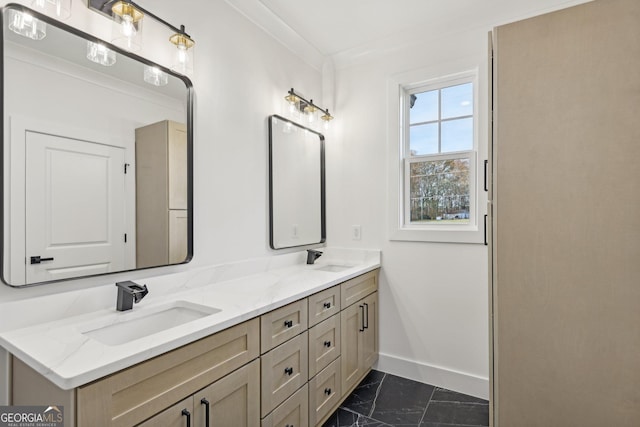 full bathroom with a sink, baseboards, double vanity, and marble finish floor