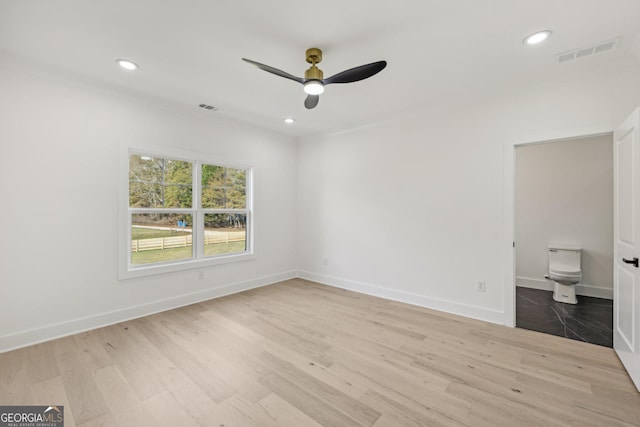 unfurnished bedroom featuring visible vents, recessed lighting, baseboards, and wood finished floors