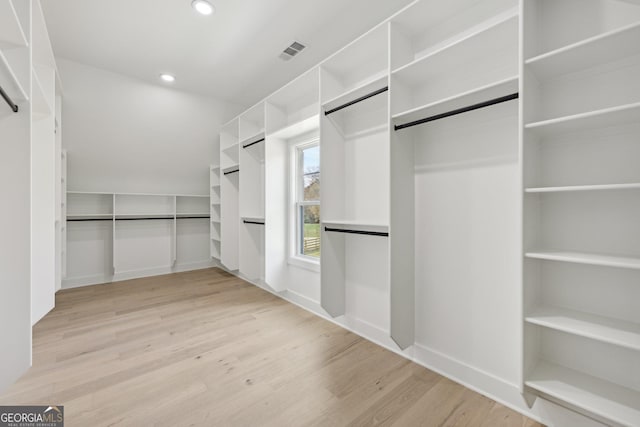 walk in closet featuring visible vents and light wood-style floors