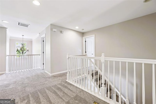 7712 Soaring Eagle Dr, Flowery Branch, GA 30542 - hallway with an upstairs landing, carpet floors, a chandelier, and recessed lighting