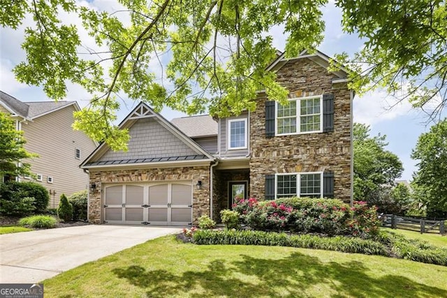 7712 Soaring Eagle Dr, Flowery Branch, GA 30542 - craftsman inspired home featuring stone siding, concrete driveway, and an attached garage