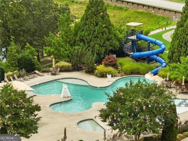 7712 Soaring Eagle Dr, Flowery Branch, GA 30542 - community pool with a water slide and a patio