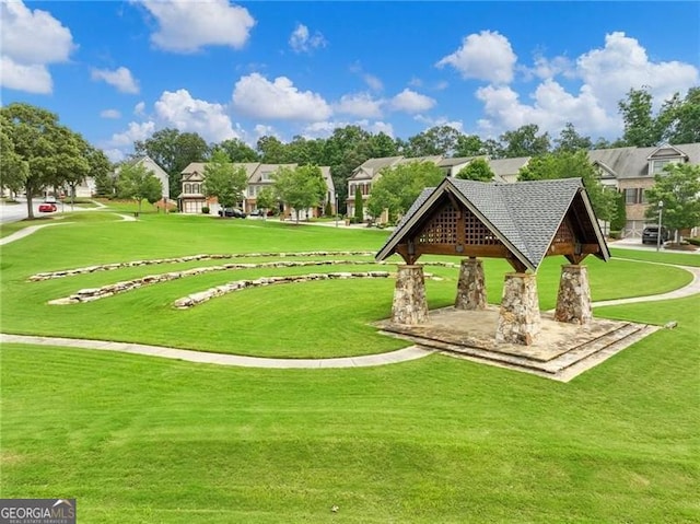 7712 Soaring Eagle Dr, Flowery Branch, GA 30542 - view of community with a gazebo, a lawn, and a residential view