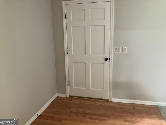 details with baseboards and wood finished floors