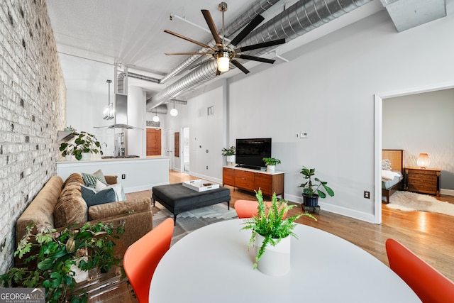 3820 Roswell Rd NE Unit 705, Atlanta, GA 30342 - living area with a ceiling fan, wood finished floors, and baseboards