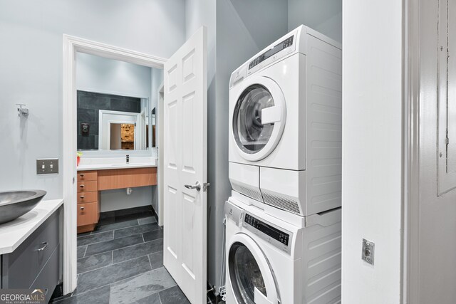 3820 Roswell Rd NE Unit 705, Atlanta, GA 30342 - laundry area with stacked washer / drying machine and a sink