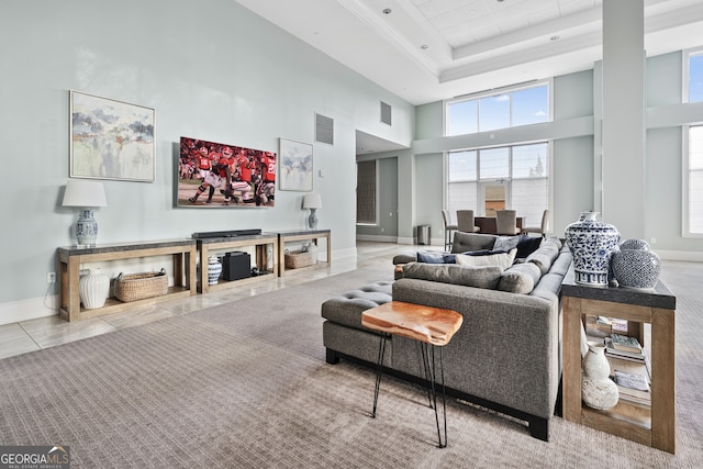3820 Roswell Rd NE Unit 705, Atlanta, GA 30342 - tiled living area featuring a towering ceiling, baseboards, and a tray ceiling