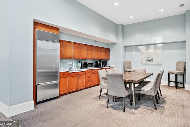 3820 Roswell Rd NE Unit 705, Atlanta, GA 30342 - dining area with light colored carpet, baseboards, and recessed lighting